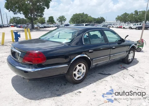 1999 Lincoln Continental из США, поврежденный, VIN 1LNHM97V5XY711570